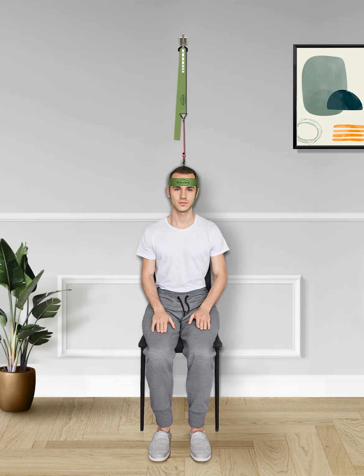 Man using Bejoyland NECKY neck trainer at home for neck training