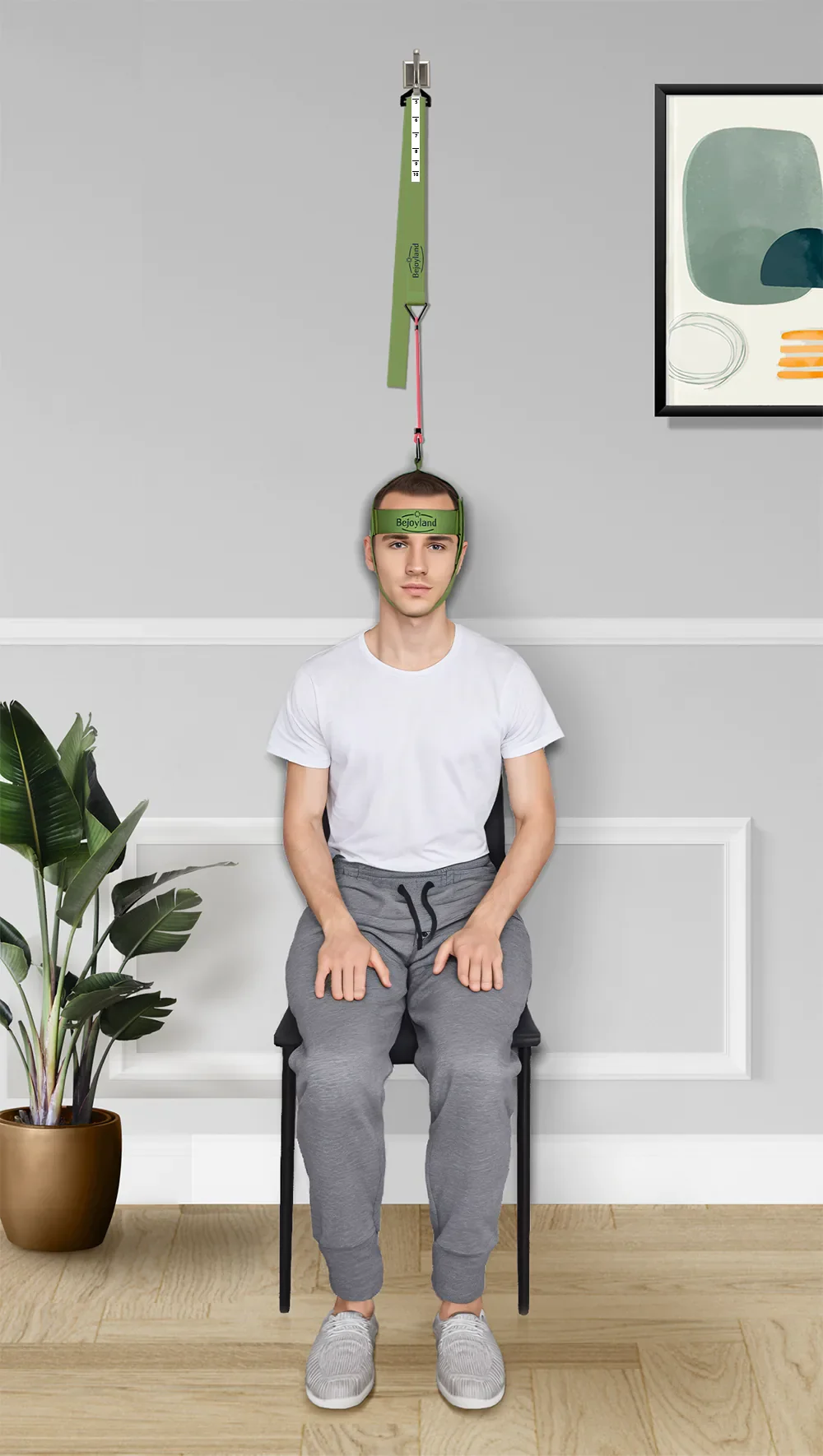 Man using Bejoyland NECKY neck trainer at home for neck training